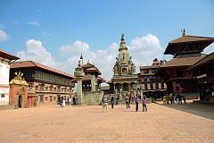 Kathmandu Bhaktapur 01-2 Bhaktapur Durbar Square With Golden Gate and Palace of 55 Windows on Left, King Bhupatindra Malla Column, Teleju Bell, Vatsala Durga Temple In Middle, Pashupatinath Temple On Right 